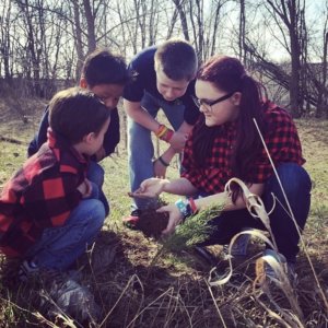 students assessing the soil and plants.